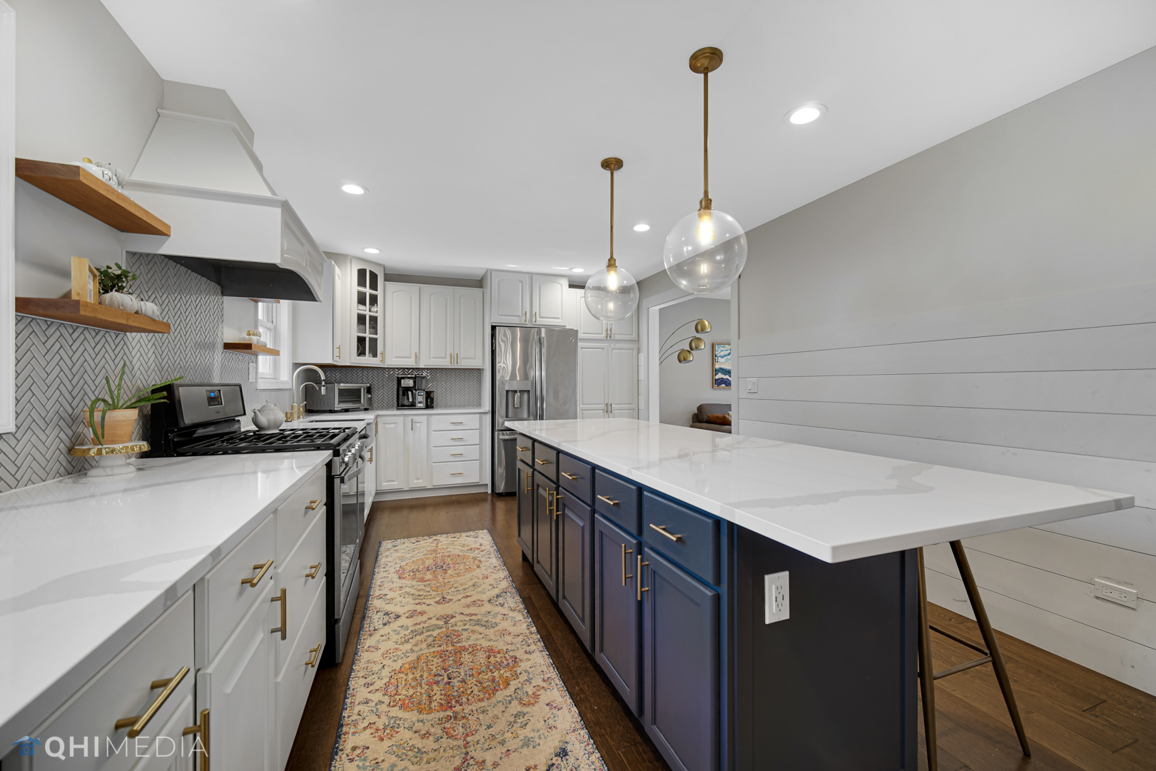 2125 Forest Ridge Road St. Charles, IL 60174 - Photo 13 of 28 a kitchen with stainless steel appliances kitchen island a large island in the center and wooden cabinets