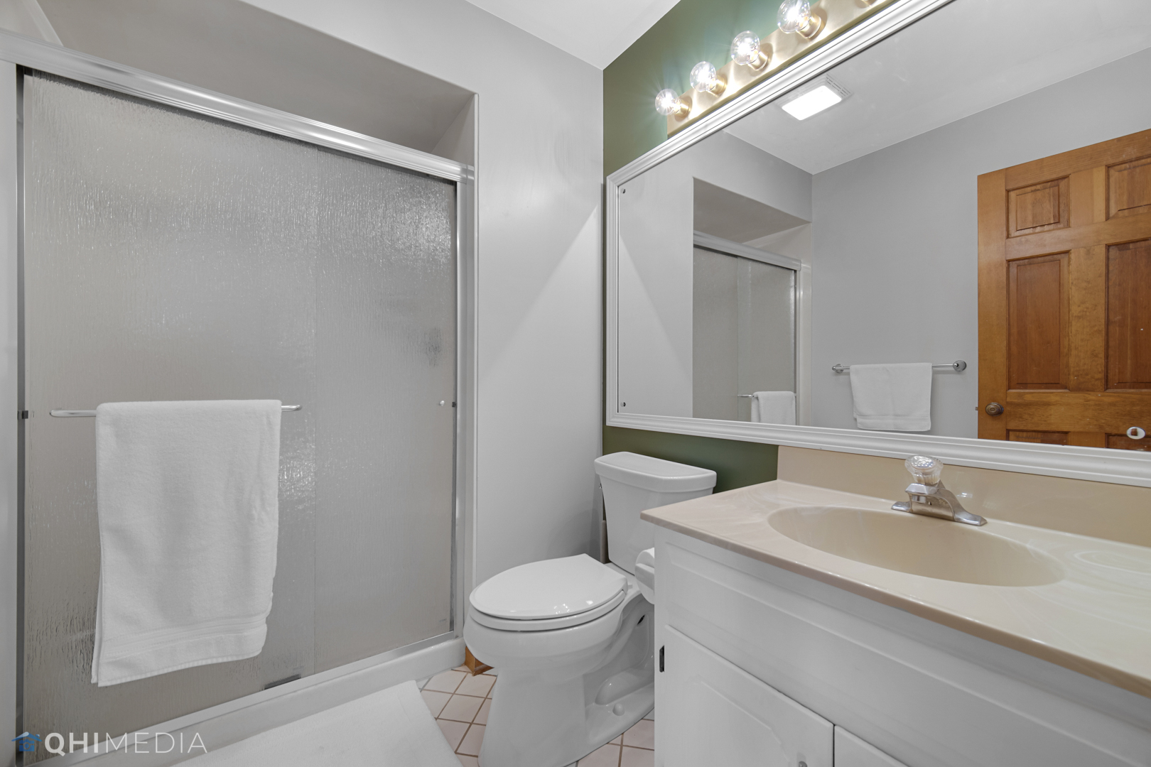 2125 Forest Ridge Road St. Charles, IL 60174 - Photo 21 of 28 a bathroom with a sink a toilet a mirror and shower