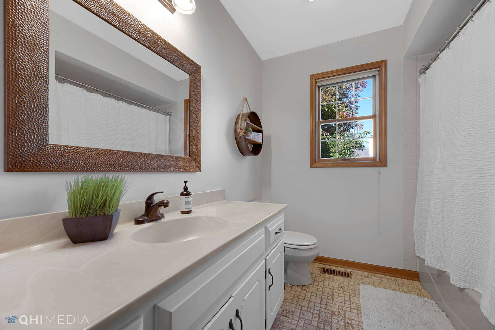 2125 Forest Ridge Road St. Charles, IL 60174 - Photo 22 of 28 a bathroom with a sink a toilet and a mirror
