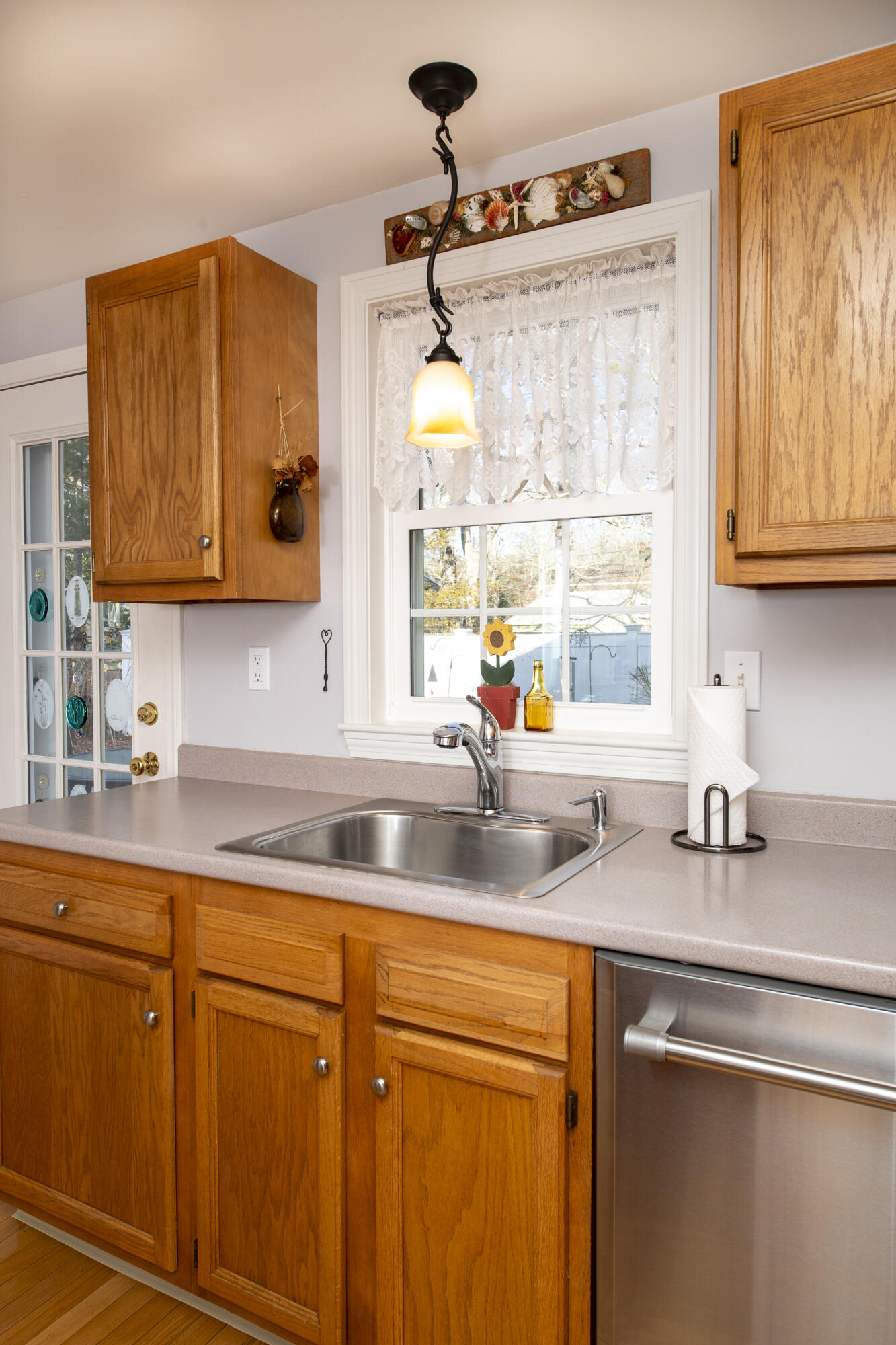 31 Mashpee Neck Road Mashpee, MA 02649 - Photo 17 of 65 a kitchen with a sink cabinets and window