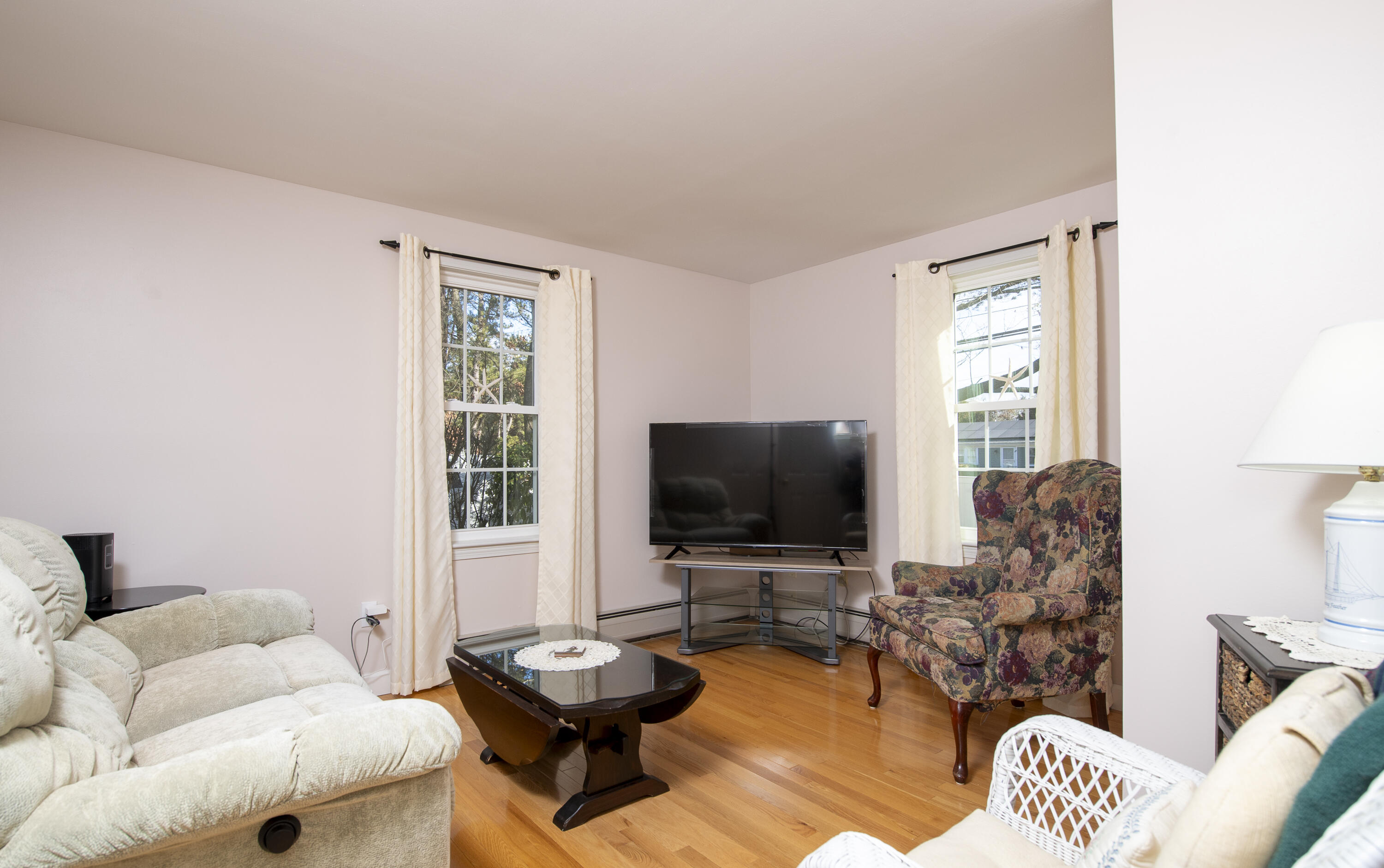 31 Mashpee Neck Road Mashpee, MA 02649 - Photo 20 of 65 a living room with furniture and a flat screen tv