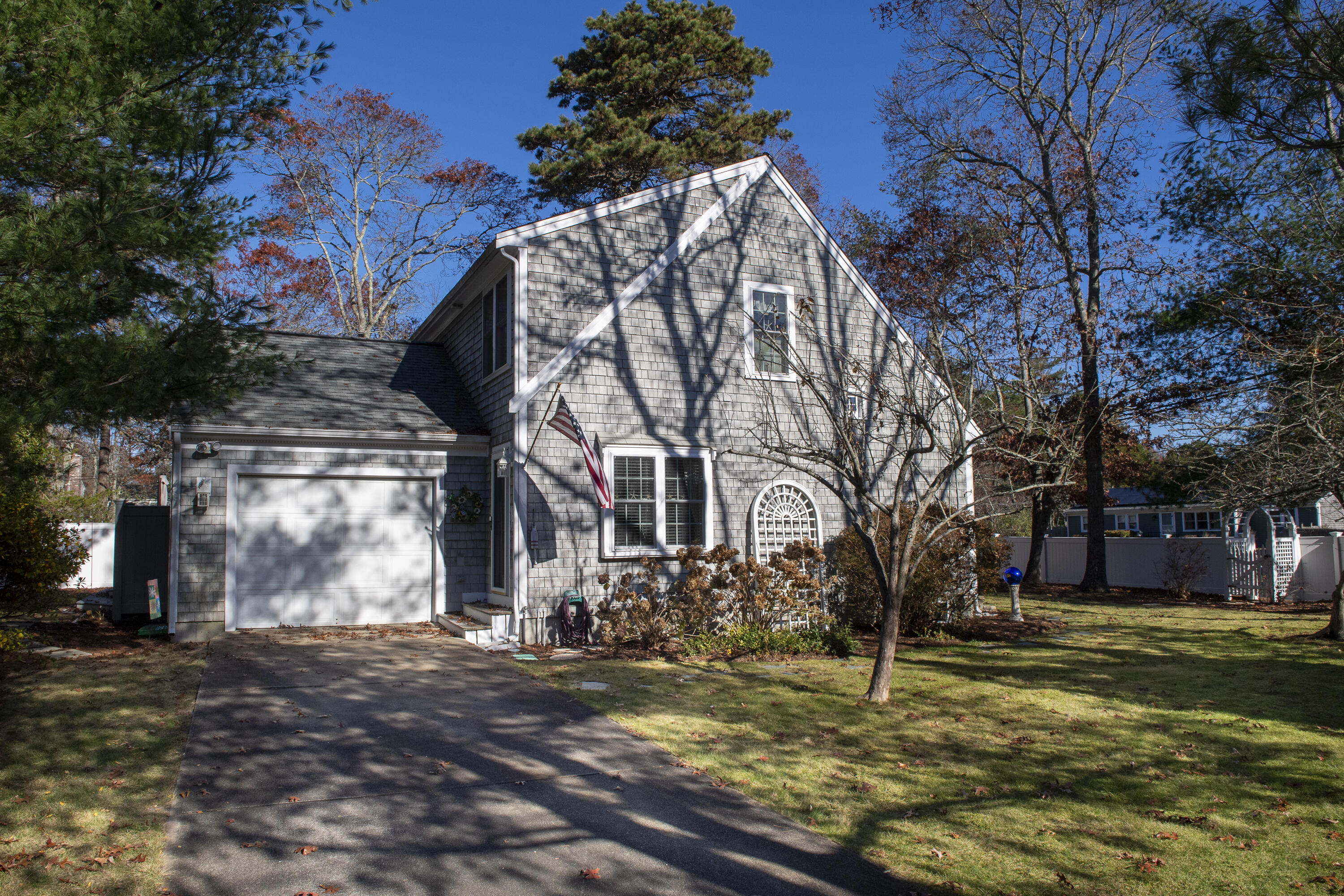 31 Mashpee Neck Road Mashpee, MA 02649 - Photo 2 of 65 a view of a yard in front of a building