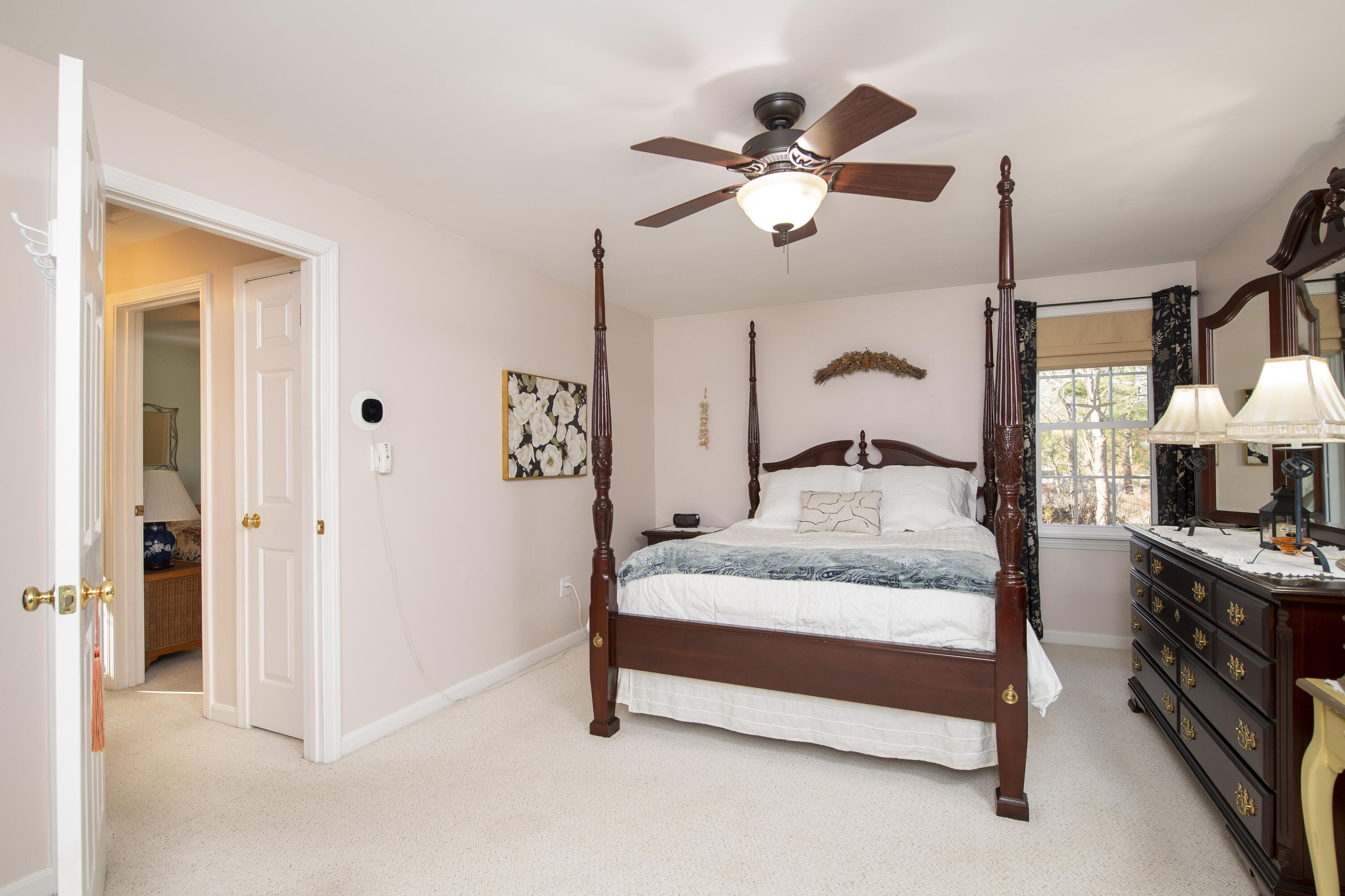 31 Mashpee Neck Road Mashpee, MA 02649 - Photo 27 of 65 a bedroom with a bed and a mirror