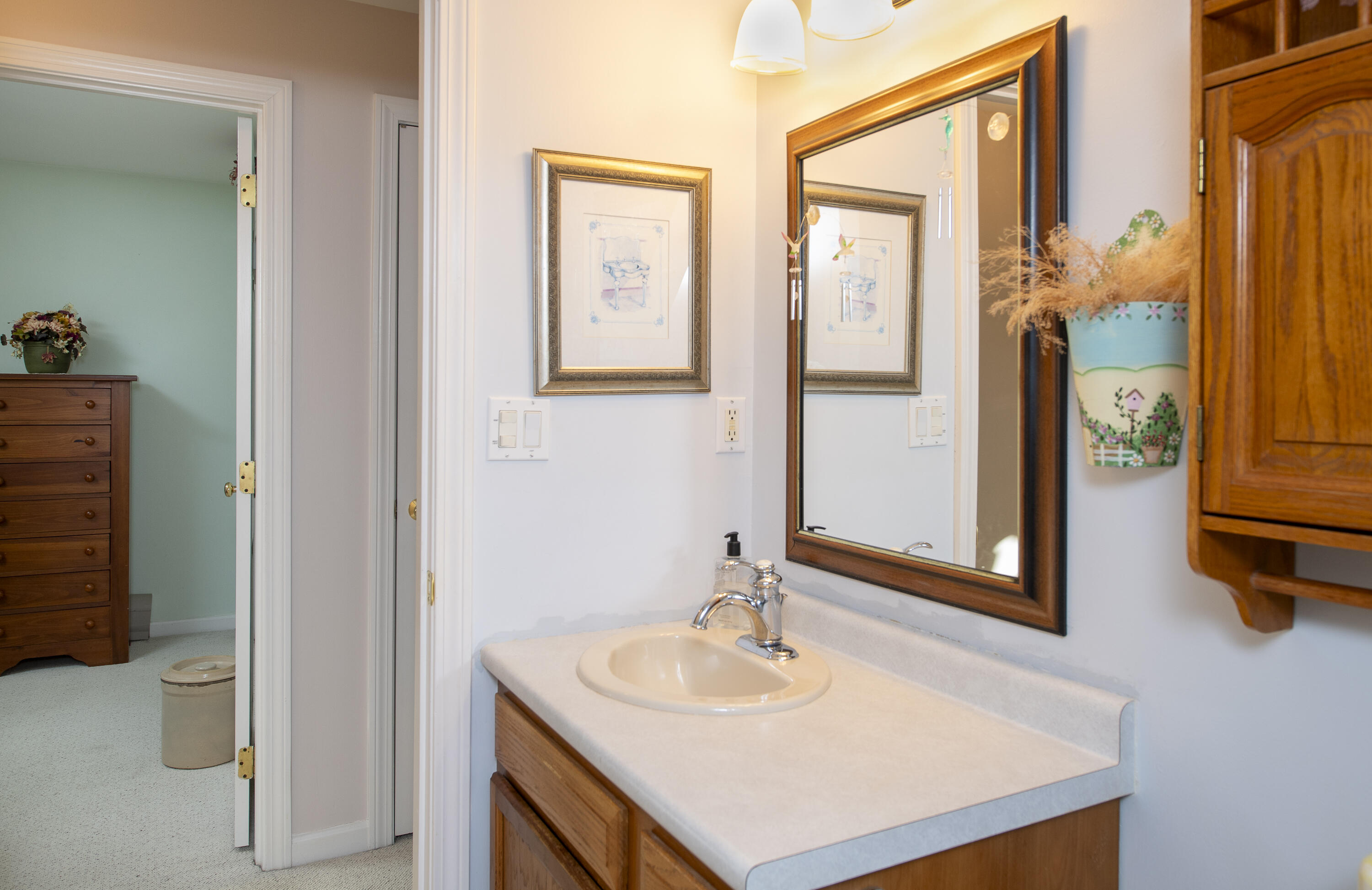 31 Mashpee Neck Road Mashpee, MA 02649 - Photo 32 of 65 a bathroom with a sink vanity and a mirror