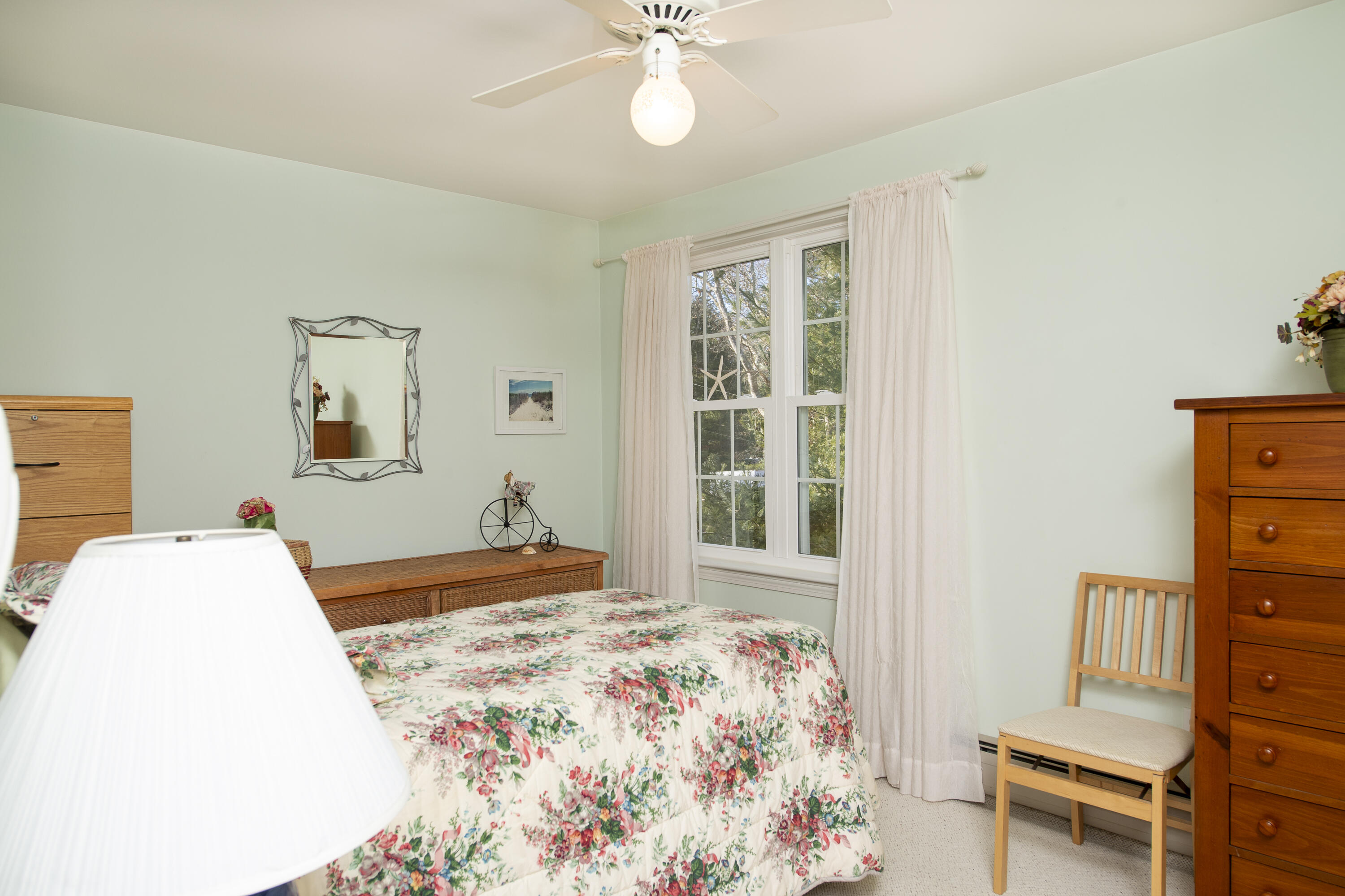 31 Mashpee Neck Road Mashpee, MA 02649 - Photo 33 of 65 a bedroom with a bed dresser and a window