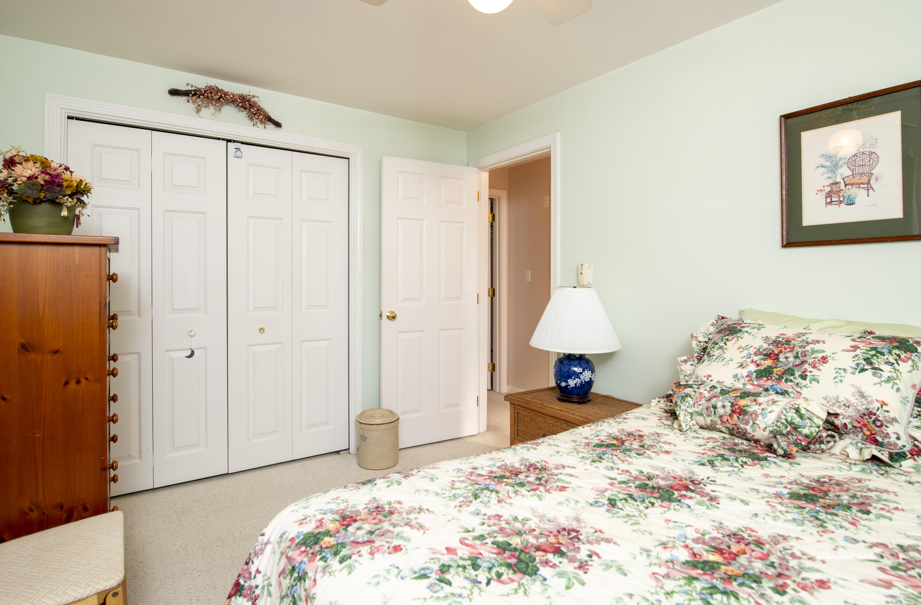 31 Mashpee Neck Road Mashpee, MA 02649 - Photo 34 of 65 a bedroom with a bed and a dresser