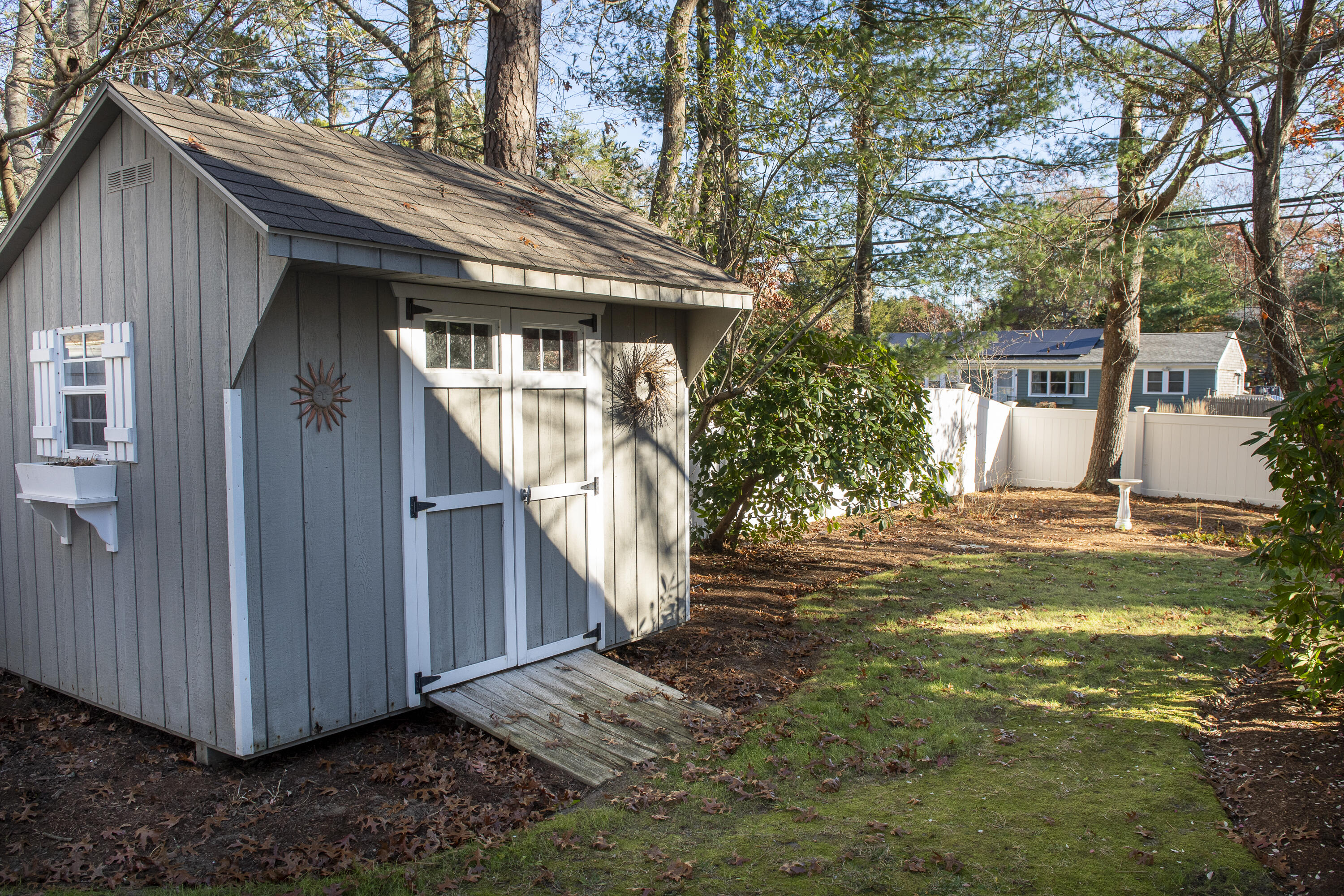 31 Mashpee Neck Road Mashpee, MA 02649 - Photo 51 of 65 a view of a house with a small yard