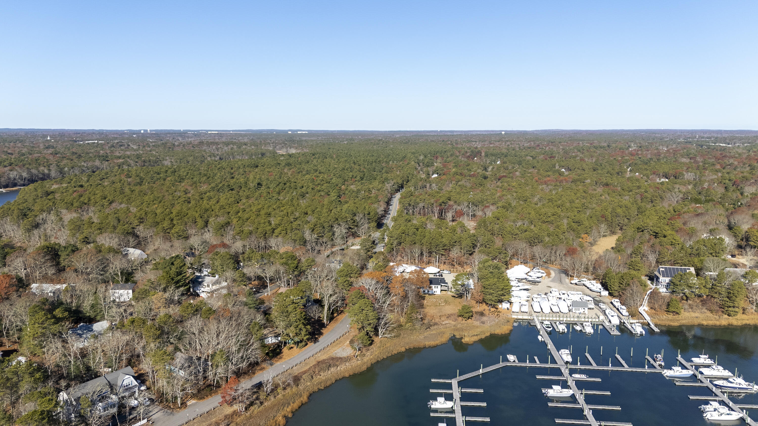 31 Mashpee Neck Road Mashpee, MA 02649 - Photo 64 of 65 an aerial view of ocean and residential houses with outdoor space