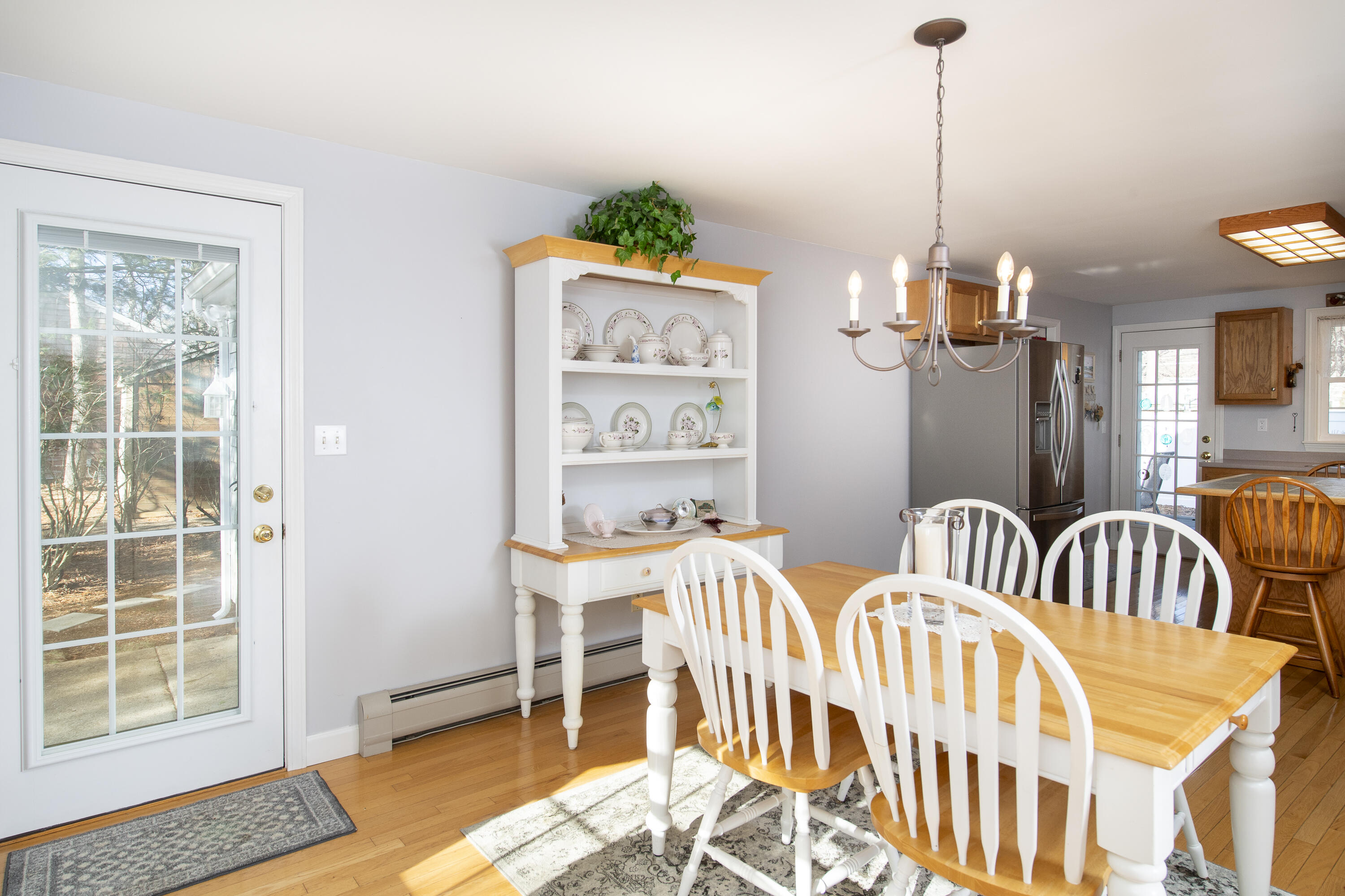 31 Mashpee Neck Road Mashpee, MA 02649 - Photo 7 of 65 a view of a dining room with furniture window and wooden floor