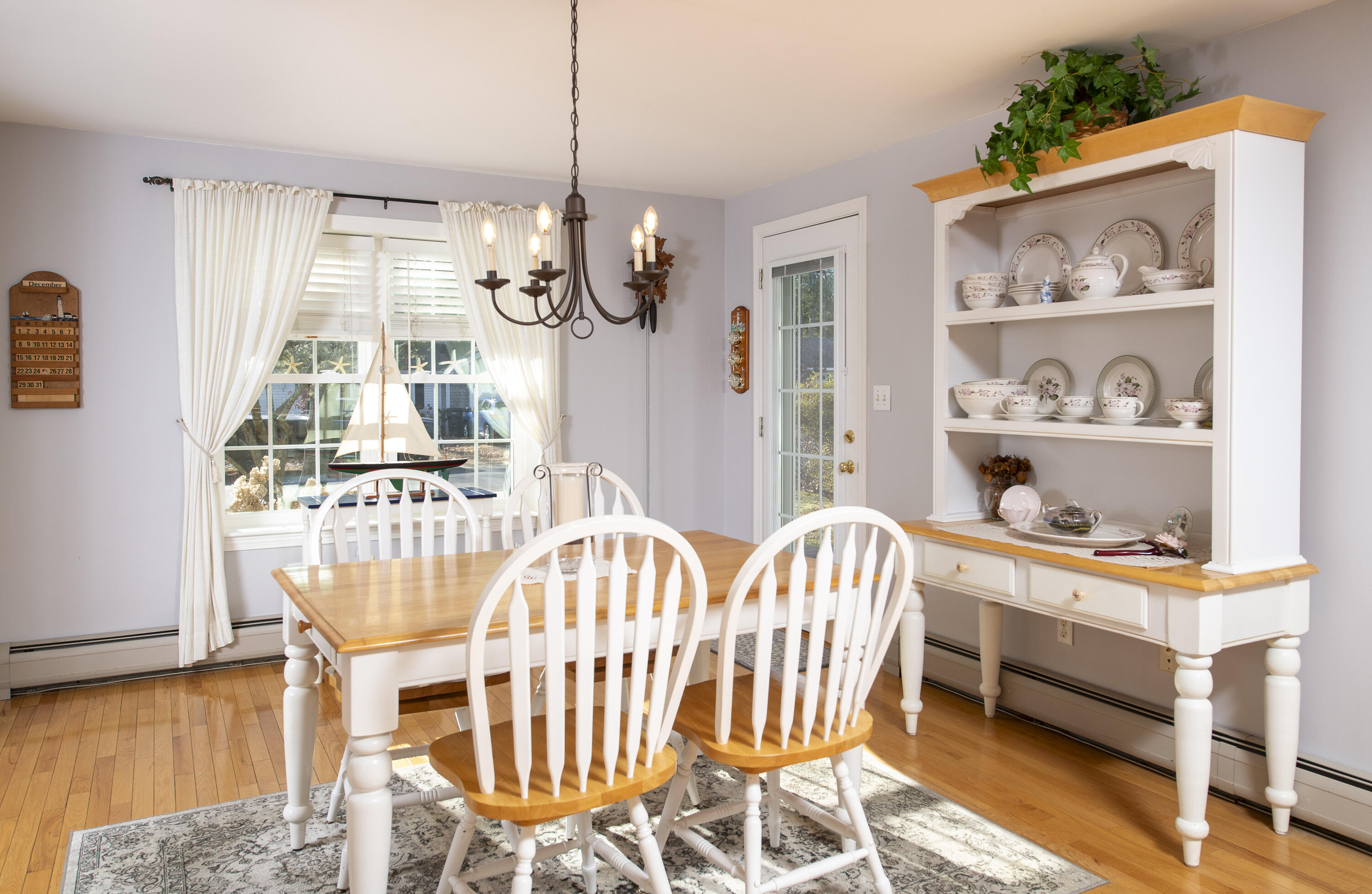 31 Mashpee Neck Road Mashpee, MA 02649 - Photo 9 of 65 a view of a dining room with furniture and wooden floor