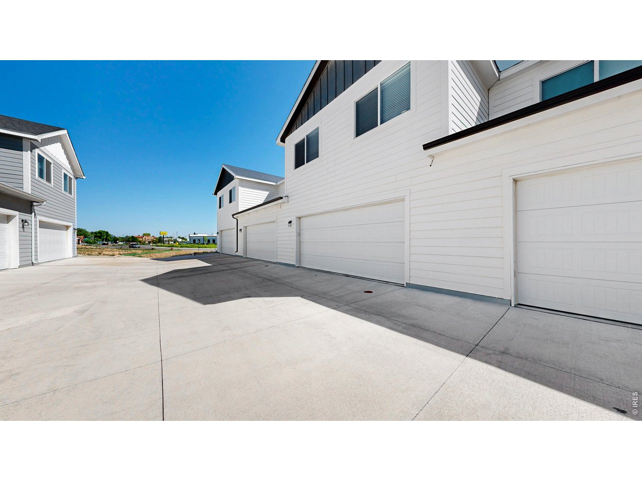 260 Pawnee Road, Unit D3 Ault, CO 80610 - Photo 36 of 44 Back view of attached heated garage with exterior key pad.