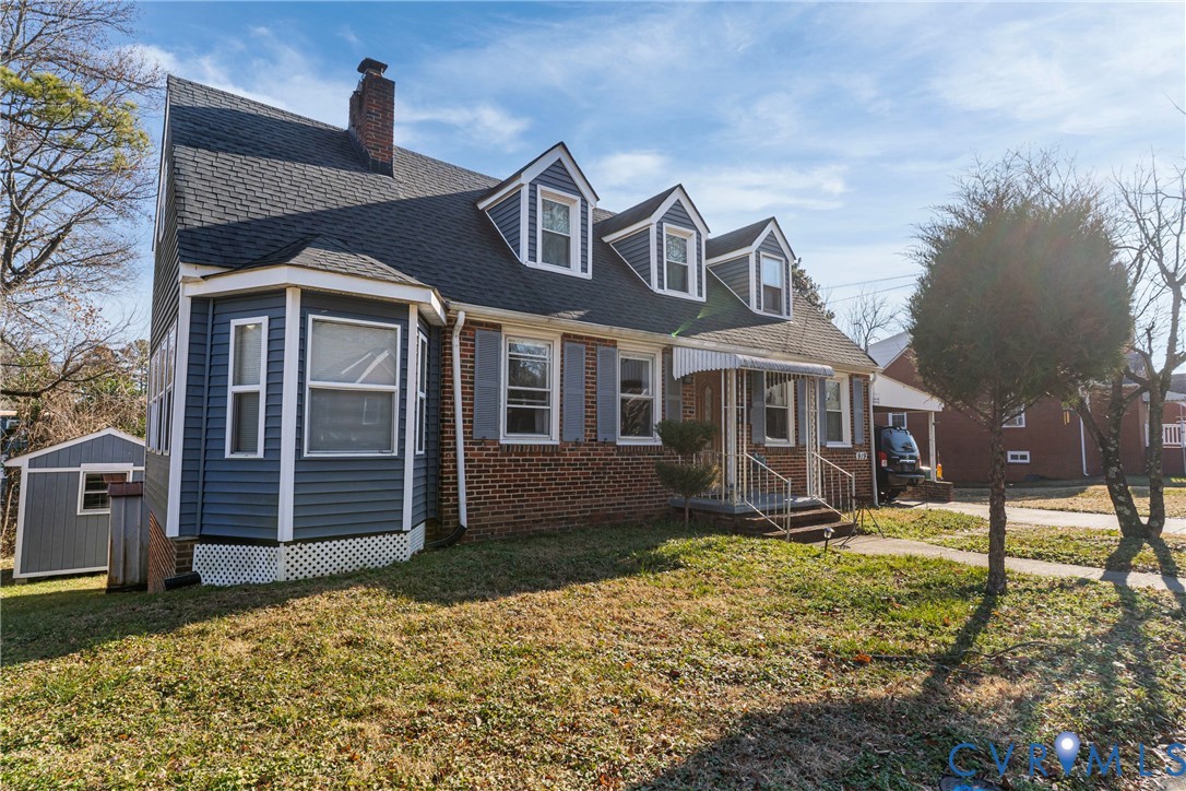 919 Colonial Avenue Colonial Heights, VA 23834 - Photo 1 of 31 a front view of a house with garden