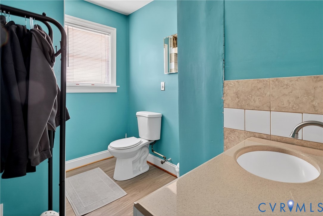 919 Colonial Avenue Colonial Heights, VA 23834 - Photo 18 of 31 a bathroom with a sink a toilet and a mirror