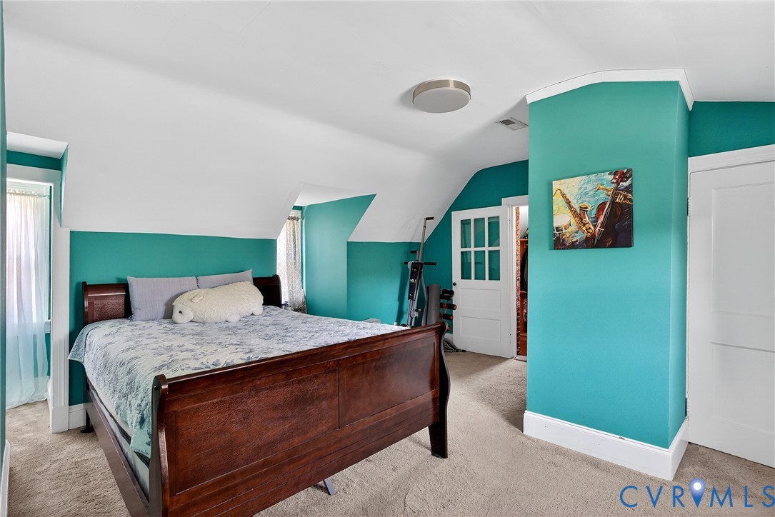 919 Colonial Avenue Colonial Heights, VA 23834 - Photo 19 of 31 a bedroom with a bed and a refrigerator