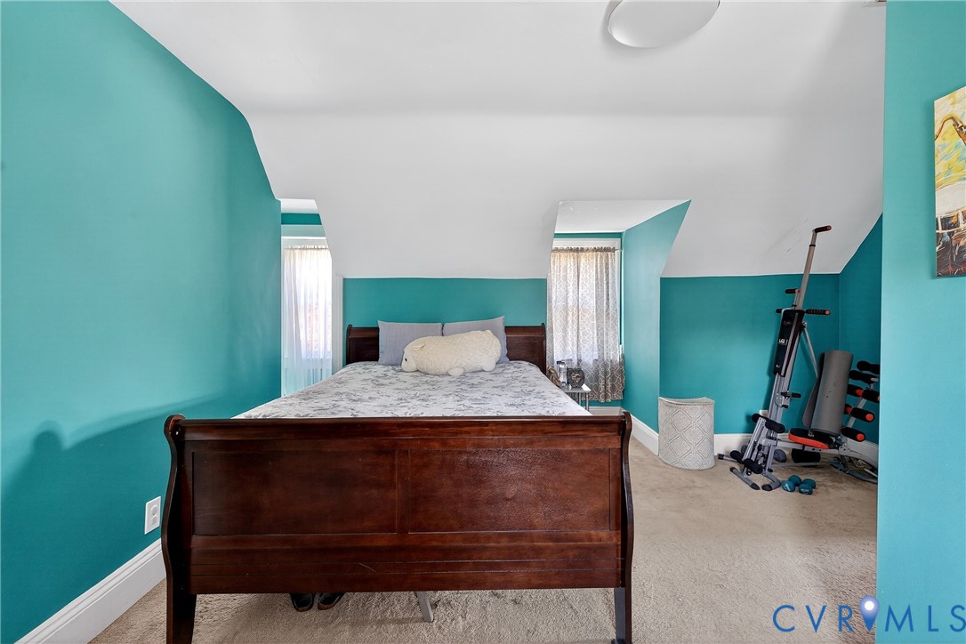 919 Colonial Avenue Colonial Heights, VA 23834 - Photo 20 of 31 a bedroom with a bed and a gym equipment