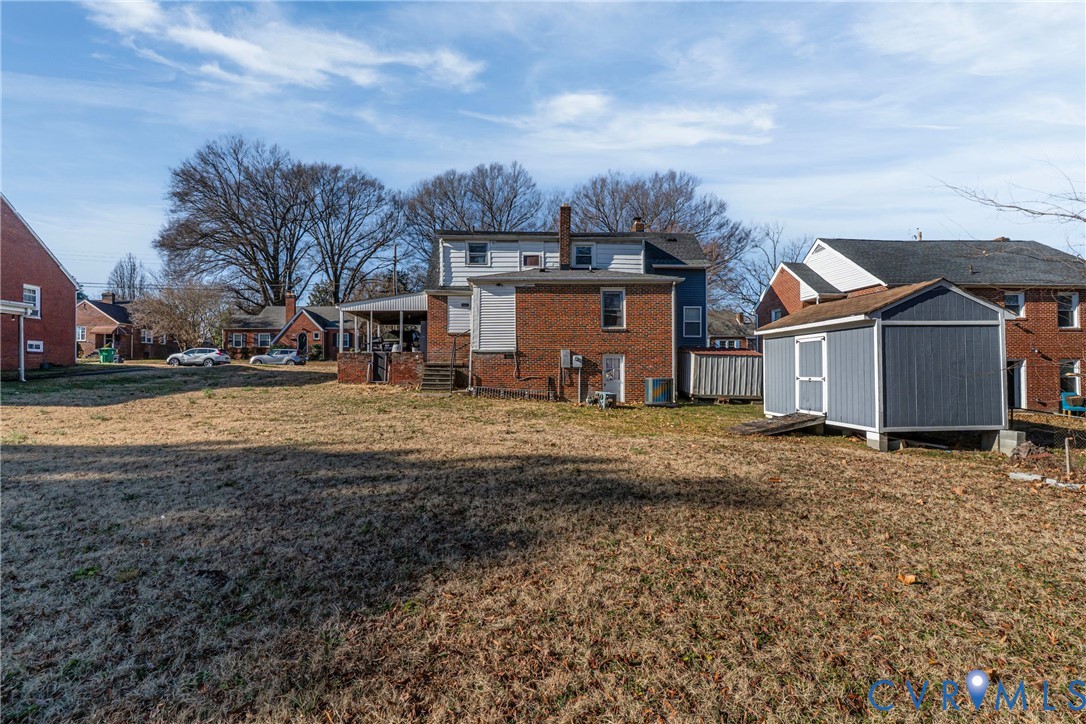 919 Colonial Avenue Colonial Heights, VA 23834 - Photo 30 of 31 a view of a house with a yard covered in the center