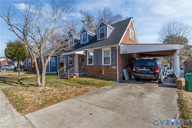 a view of a car park in front of house