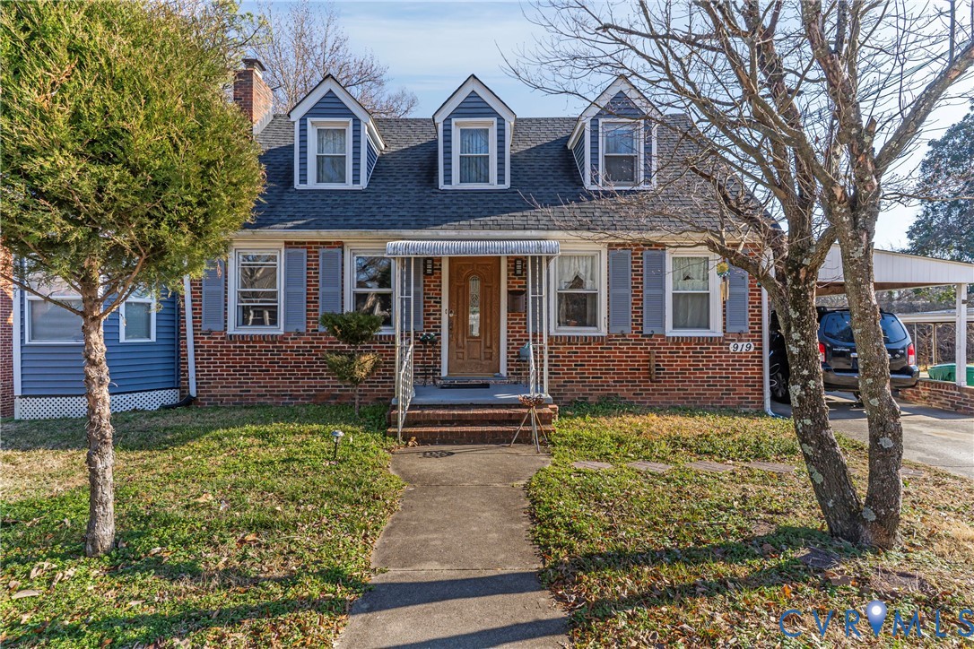 919 Colonial Avenue Colonial Heights, VA 23834 - Photo 3 of 31 a front view of a house with garden