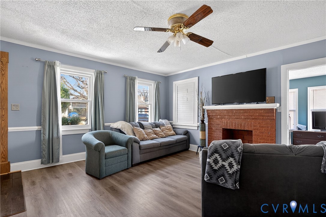 919 Colonial Avenue Colonial Heights, VA 23834 - Photo 6 of 31 a living room with furniture a fireplace and a flat screen tv