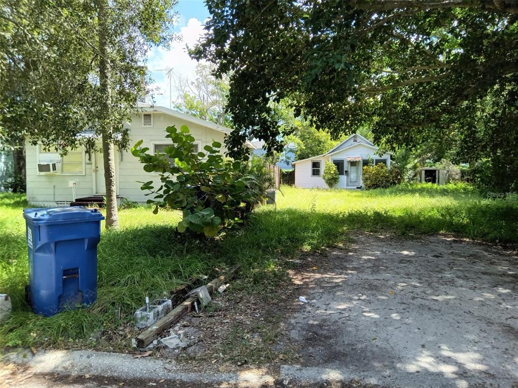 3121 Queen Street North St. Petersburg, FL 33713 - Photo 1 of 1 a view of a house with a yard and large tree