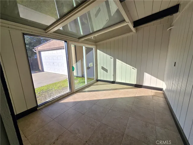 a view of an empty room with a fireplace