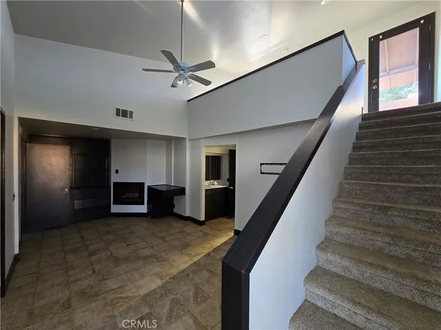 a view of bathroom with a sink and mirror
