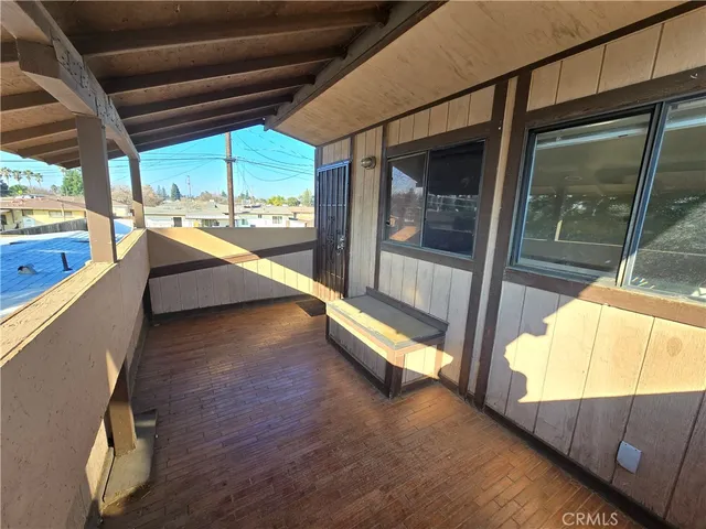 a view of a room with wooden walls
