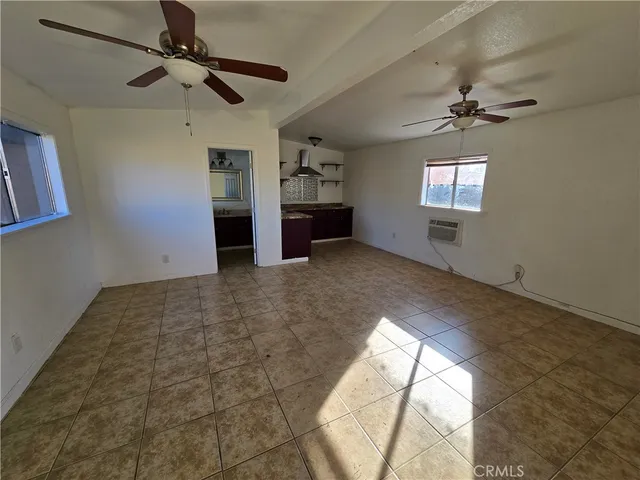 a kitchen with a stove and a refrigerator