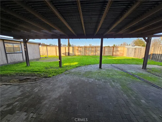 a view of a backyard of the house