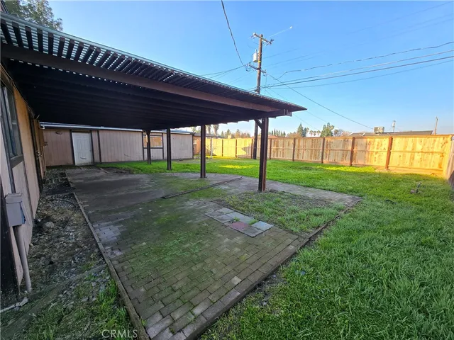 a view of a house with a yard and porch