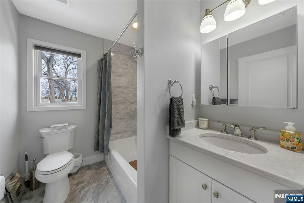 51 Terrace Street Park Ridge, NJ 07656 - Photo 15 of 29 a bathroom with a granite countertop sink toilet and shower