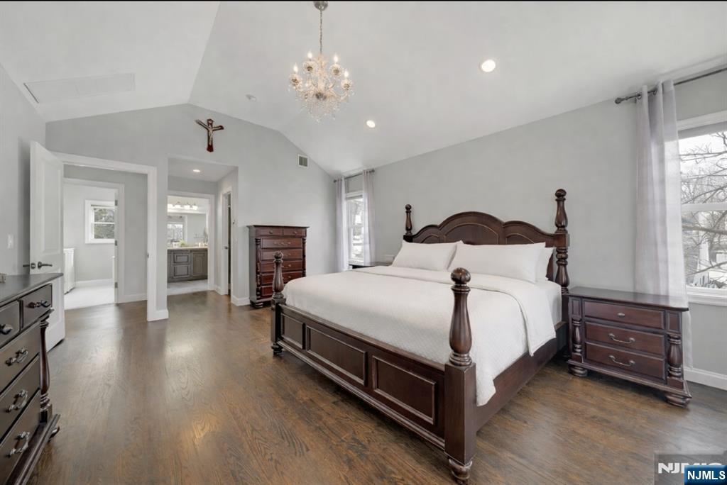 51 Terrace Street Park Ridge, NJ 07656 - Photo 18 of 29 a bedroom with a large bed and a chandelier