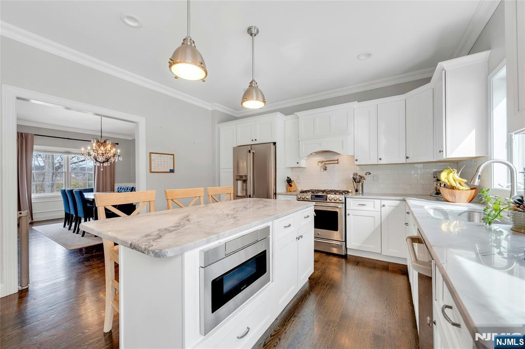 51 Terrace Street Park Ridge, NJ 07656 - Photo 6 of 29 a kitchen with a stove sink and cabinets