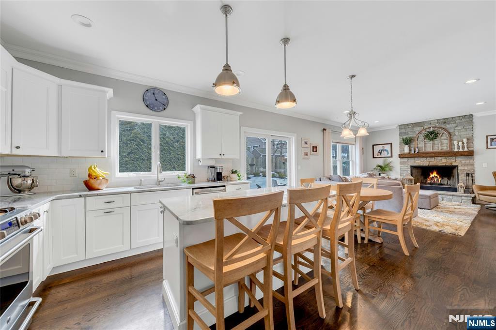 51 Terrace Street Park Ridge, NJ 07656 - Photo 7 of 29 a large kitchen with a table and chairs in it