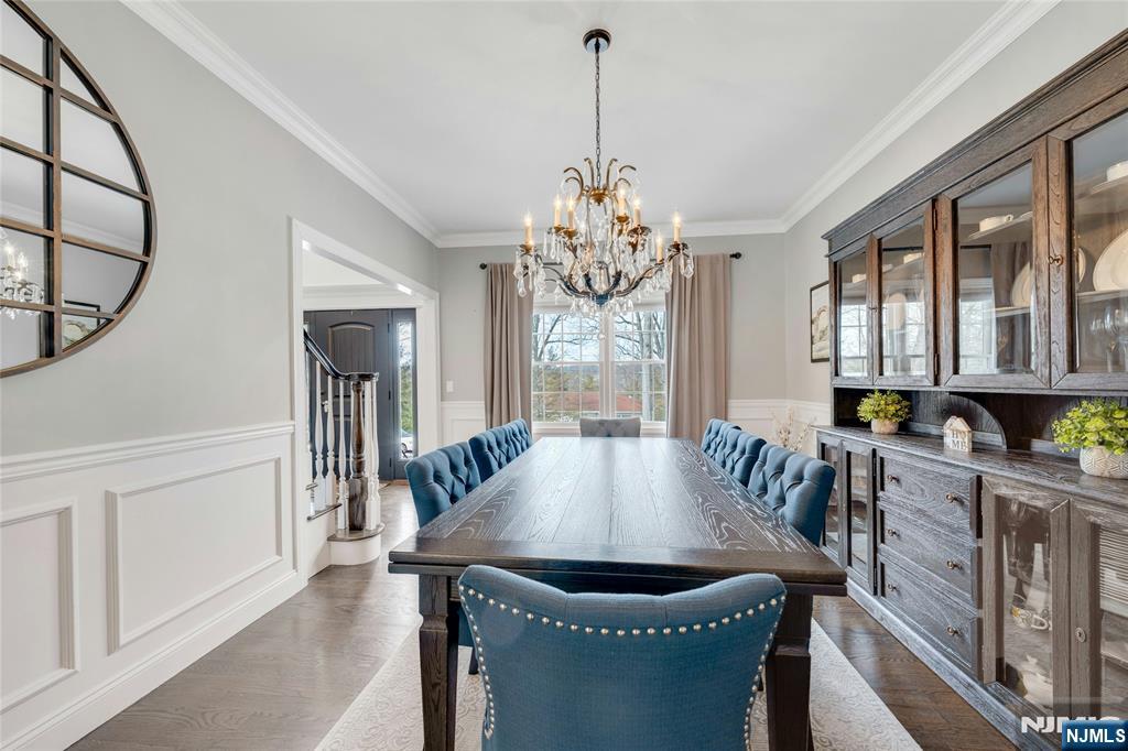 51 Terrace Street Park Ridge, NJ 07656 - Photo 9 of 29 a dining room with furniture a chandelier and wooden floor
