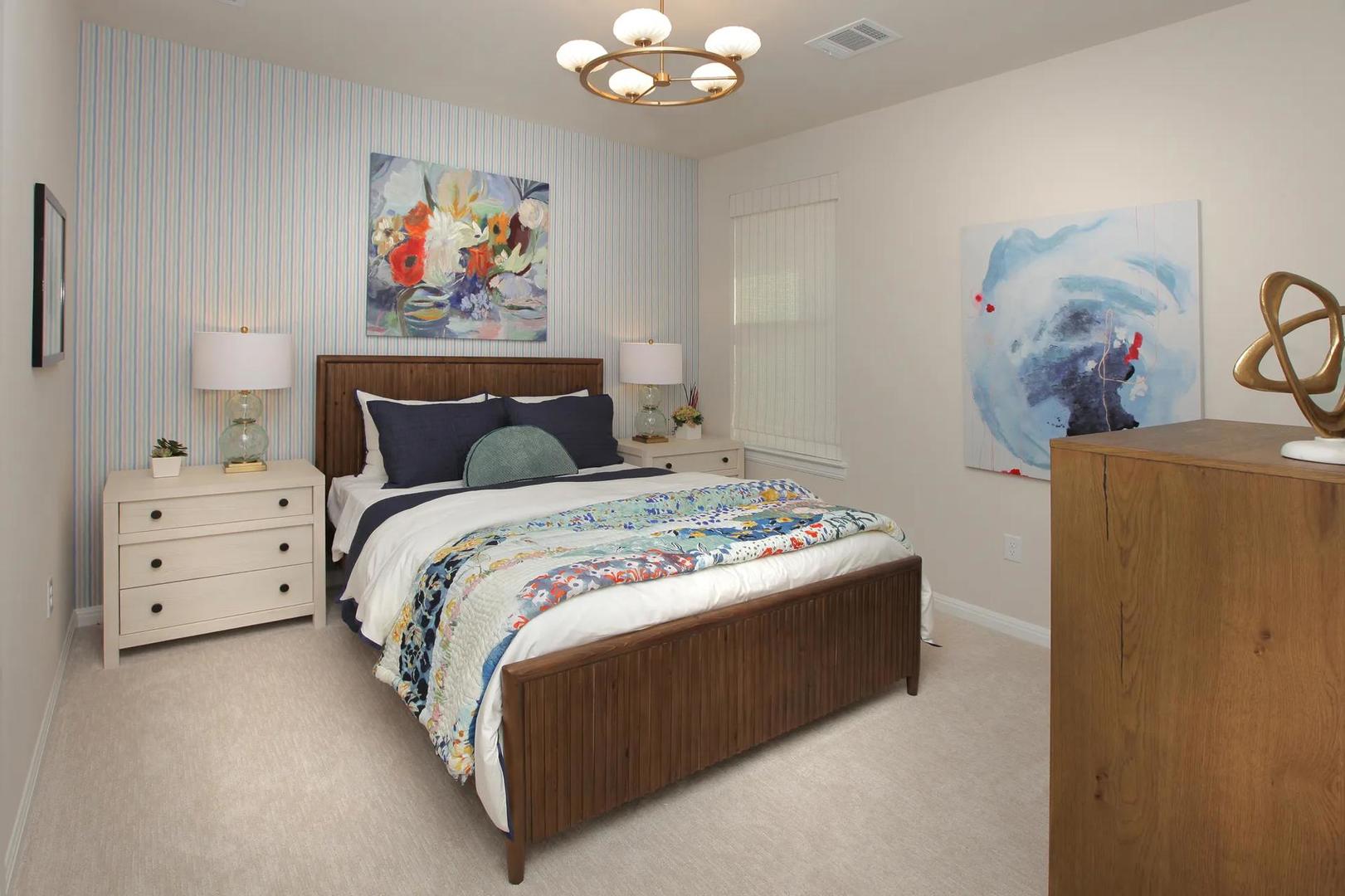 2033 Morning Mist Drive Georgetown, TX 78628 - Photo 30 of 36 a bedroom with a bed and wall painting on the wall