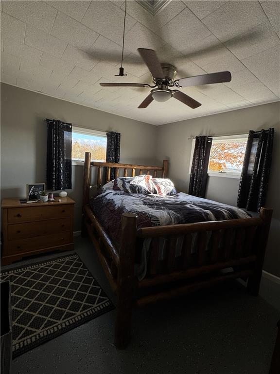 2672 West County Line Road Jamestown, PA 16134 - Photo 14 of 14 a bed sitting in a bedroom next to a window