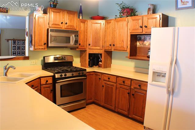 2465 Evergreen Road Colorado Springs, CO 80921 - Photo 10 of 25 Generous countertop bar