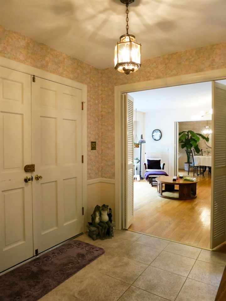 613 Compton Road Raleigh, NC 27609 - Photo 2 of 25 Welcoming Foyer w/chair rail molding & coat closet. Foyer
