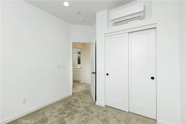 a view of a hallway with closet area