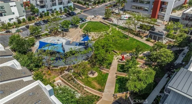 an aerial view of a house with a yard and outdoor seating