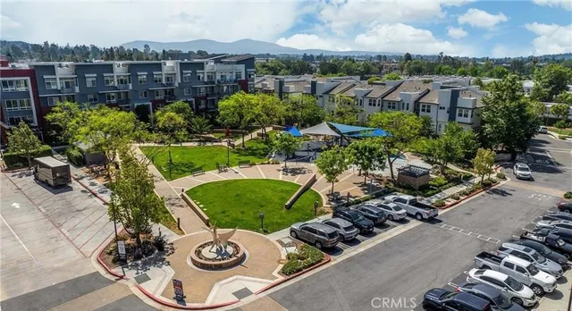 an aerial view of a house with garden space and street view