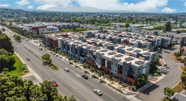 an aerial view of residential houses and city view