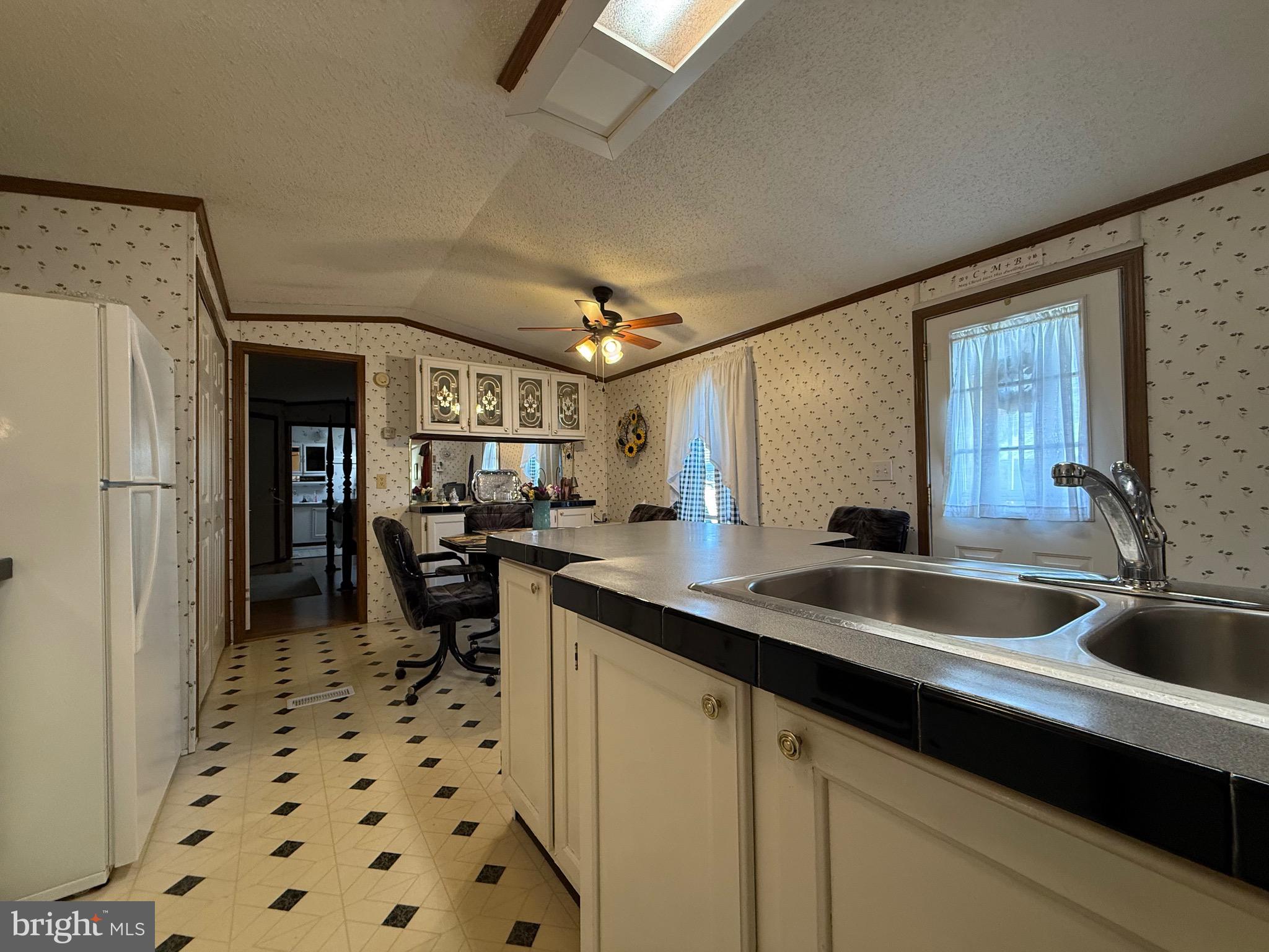114 Pheasant Ridge Circle Lancaster, PA 17603 - Photo 14 of 30 a kitchen with a sink and a refrigerator