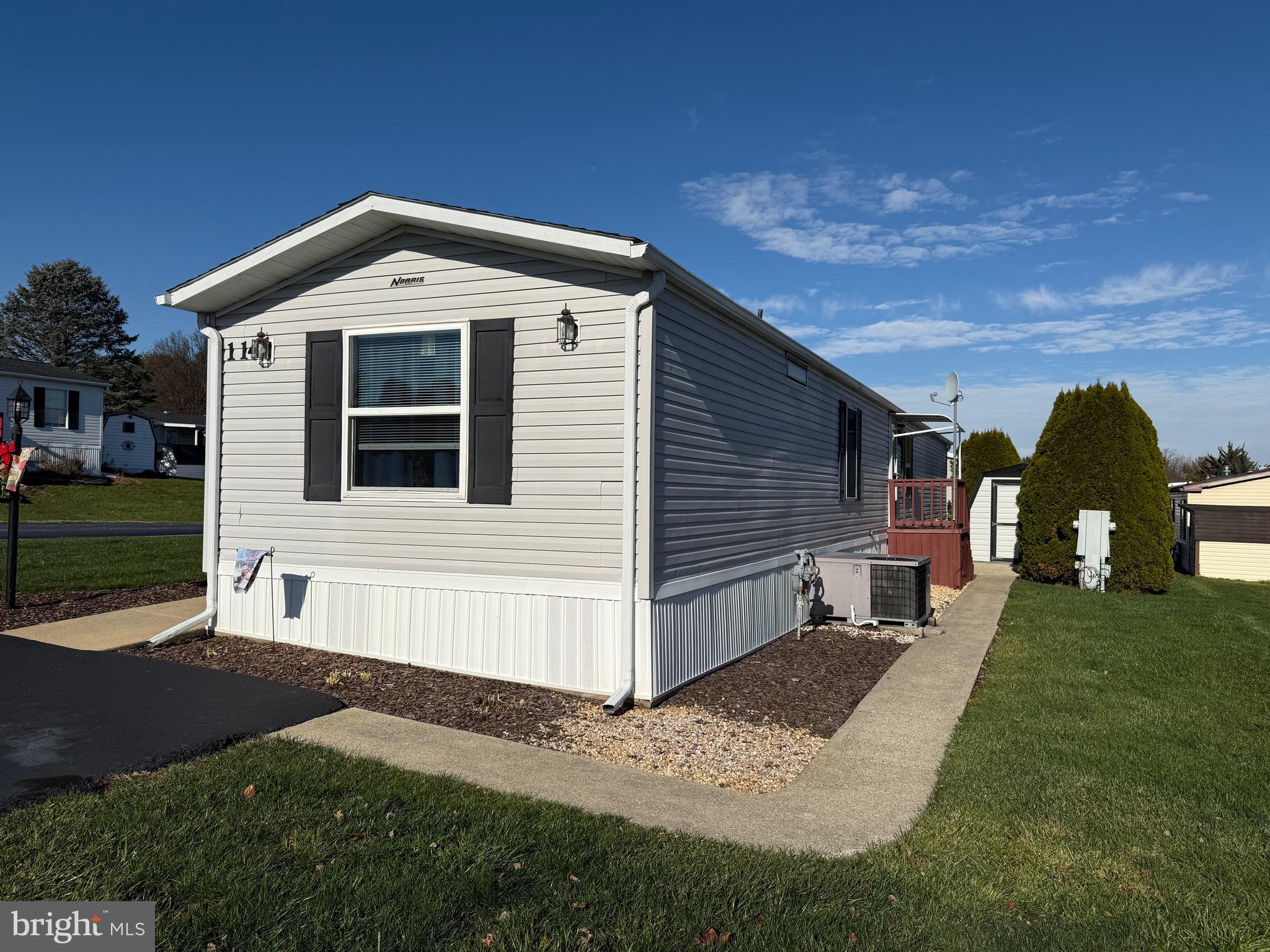 114 Pheasant Ridge Circle Lancaster, PA 17603 - Photo 2 of 24 a front view of a house with a yard
