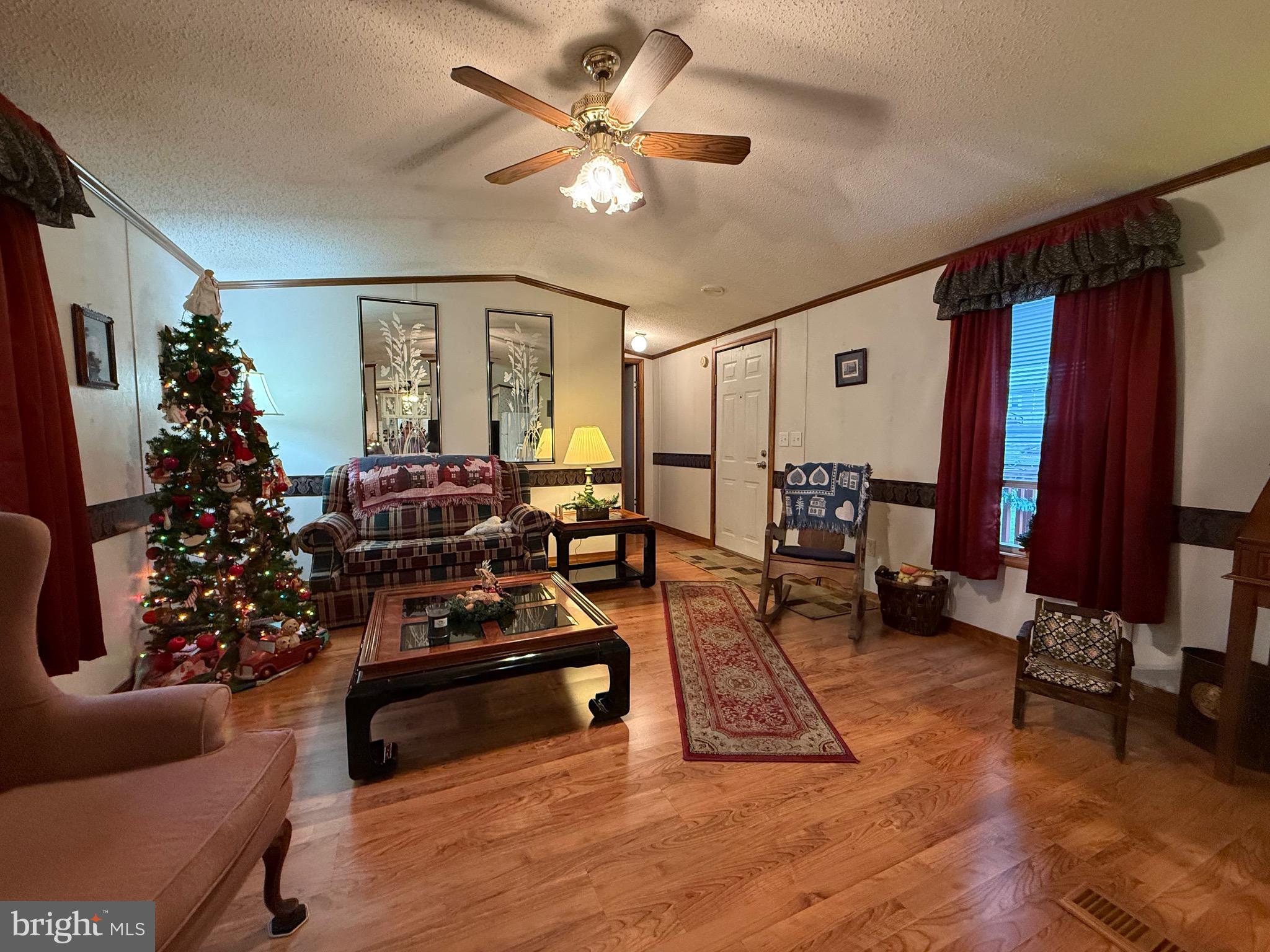 114 Pheasant Ridge Circle Lancaster, PA 17603 - Photo 5 of 24 a living room with furniture a dining table and a piano