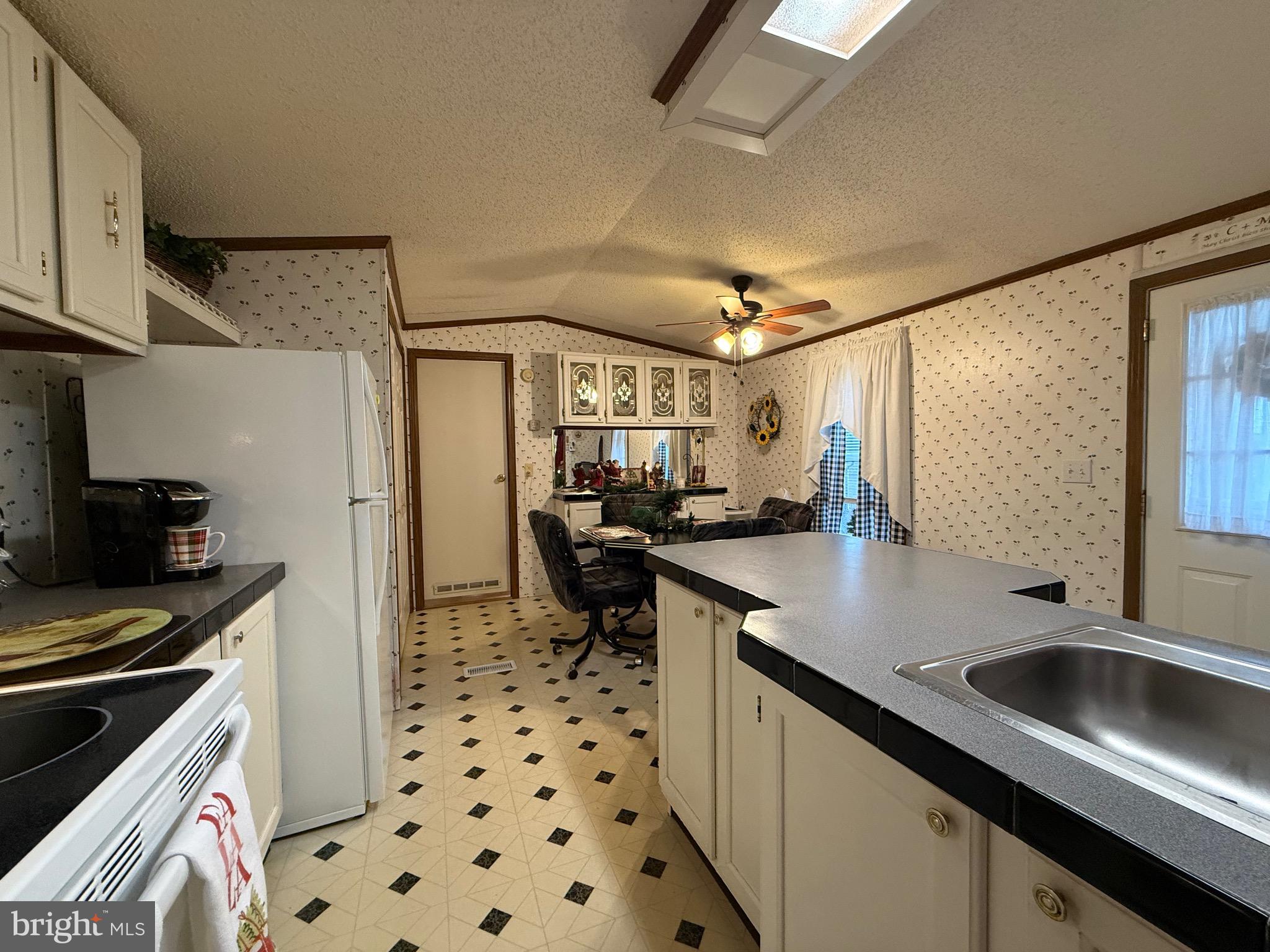 114 Pheasant Ridge Circle Lancaster, PA 17603 - Photo 8 of 24 a kitchen with stainless steel appliances a sink stove and refrigerator