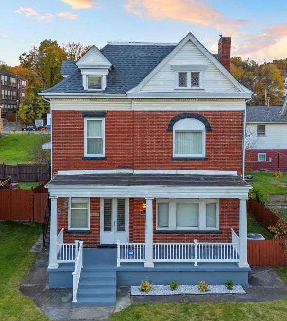 1336 4th Avenue Coraopolis, PA 15108 - Photo 1 of 50 a front view of a house with a yard