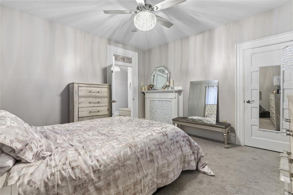 1336 4th Avenue Coraopolis, PA 15108 - Photo 20 of 50 a bedroom with a bed and a chandelier