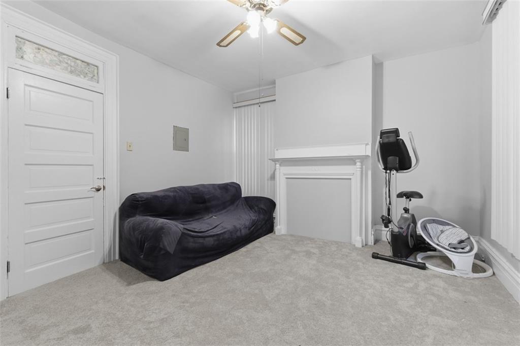 1336 4th Avenue Coraopolis, PA 15108 - Photo 24 of 50 a bedroom with a bed and a chandelier